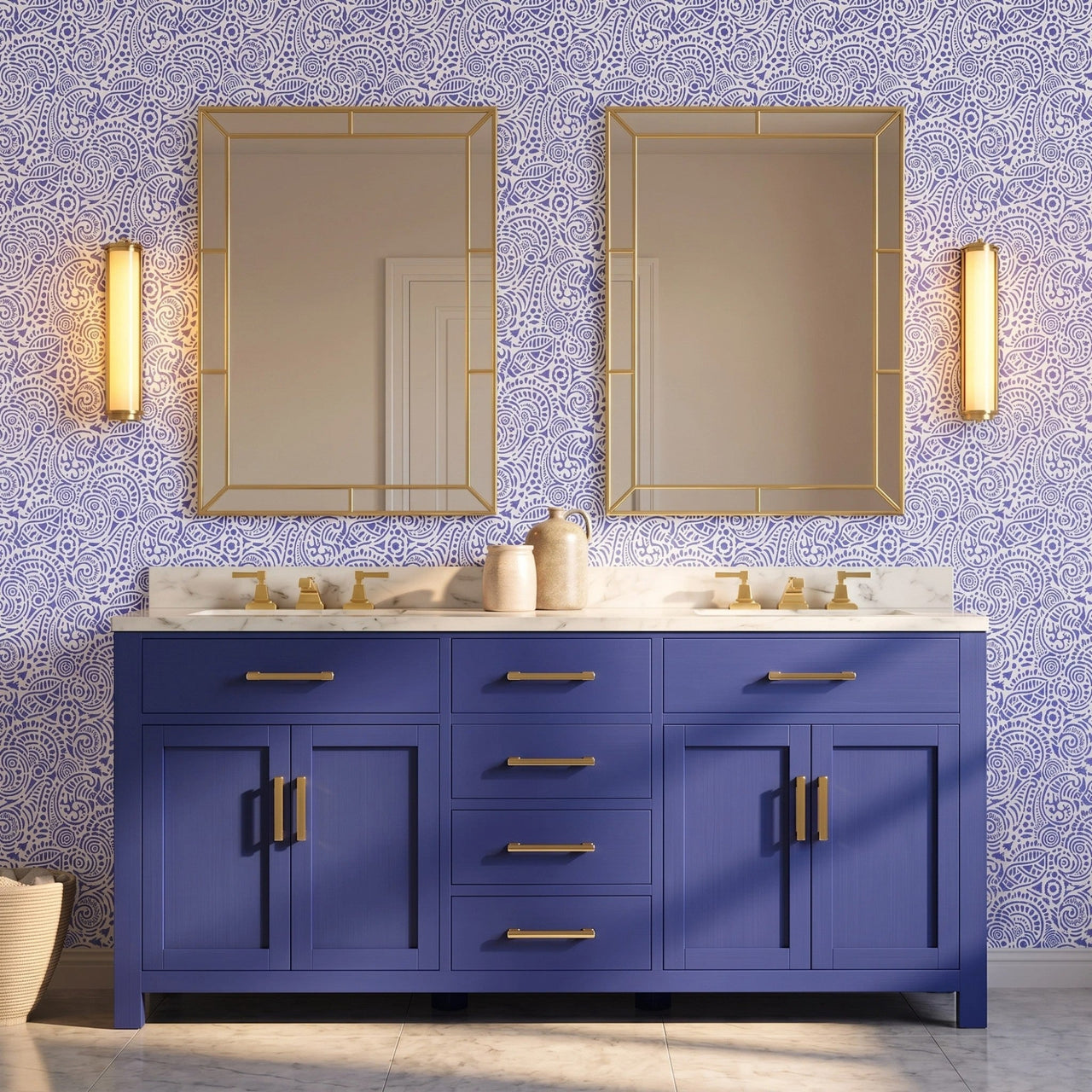 Abstract seashells wall stencil applied in a double bathroom vanity with a deep blue cabinet, white marble countertop, two matching gold-framed mirrors and wall sconces, and light highlighting the dark blue and white painted stencil on the wall.