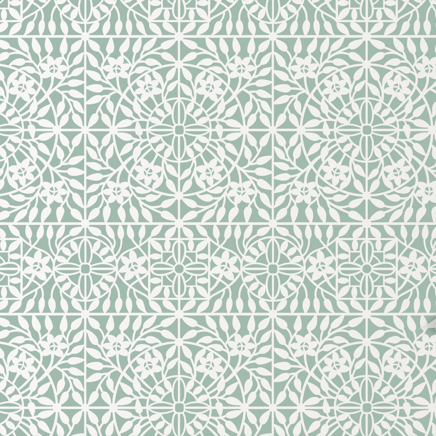 Botanical tile wall stencil in green and white floral and geometric motifs.