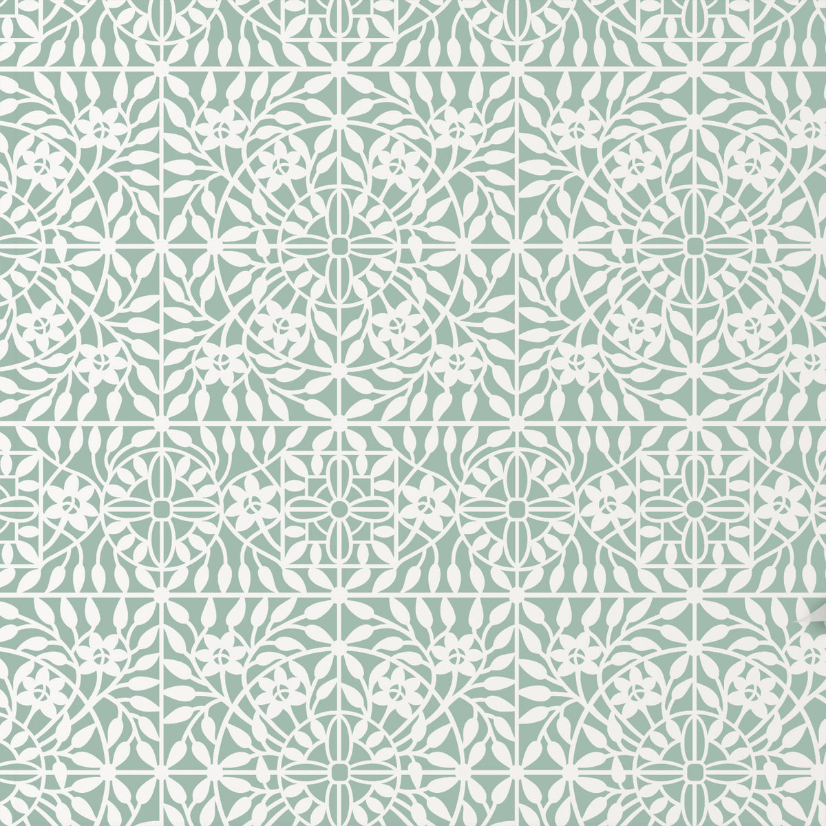 Botanical tile wall stencil in green and white floral and geometric motifs.
