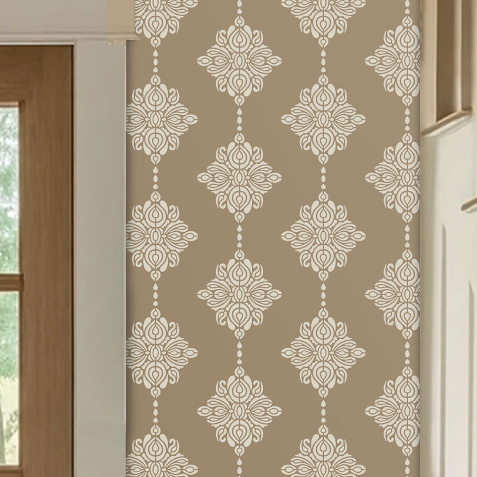 Beige hallway with a repeating white damask block print floral wall stencil pattern shown installed on an interior wall next to a window and door frame.