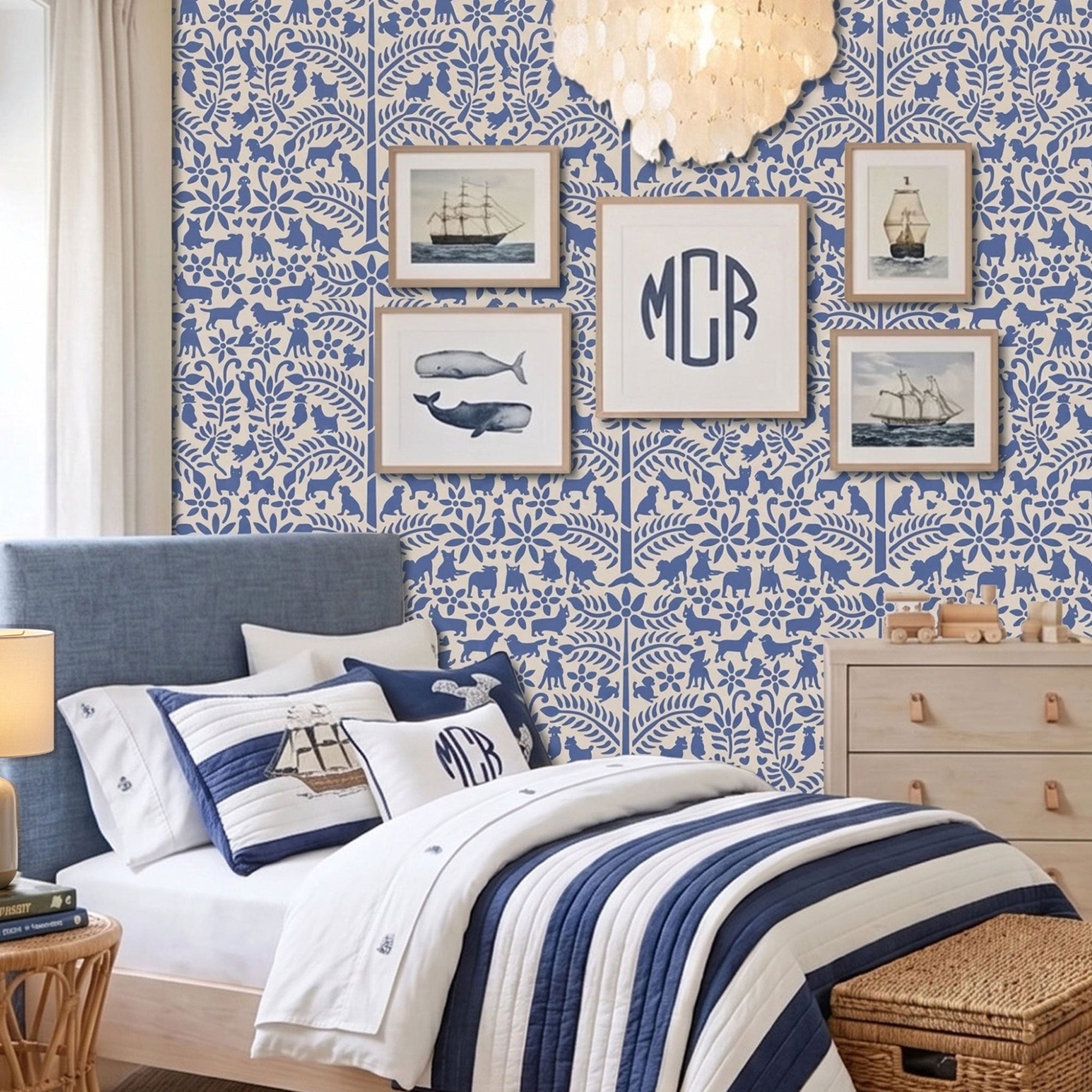 Dogs in the garden wall stencil applied in a children's bedroom featuring a bed with navy and white striped bedding, framed prints, a wood dresser, and a chandelier, and natural light highlighting the dark blue and beige painted stencil on the wall.