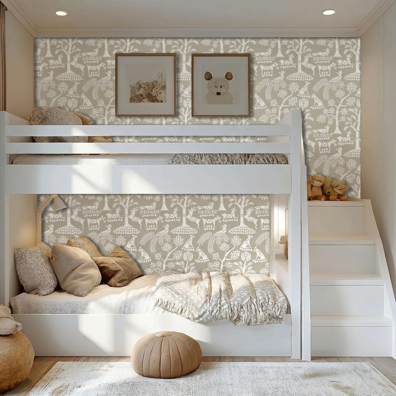 Enchanted forest wall stencil in a children's bedroom featuring a white bunk bed, two framed animal prints on the wall, a staircase ladder on the right, pillows, with natural light highlighting the taupe and white painted stencil on the wall.