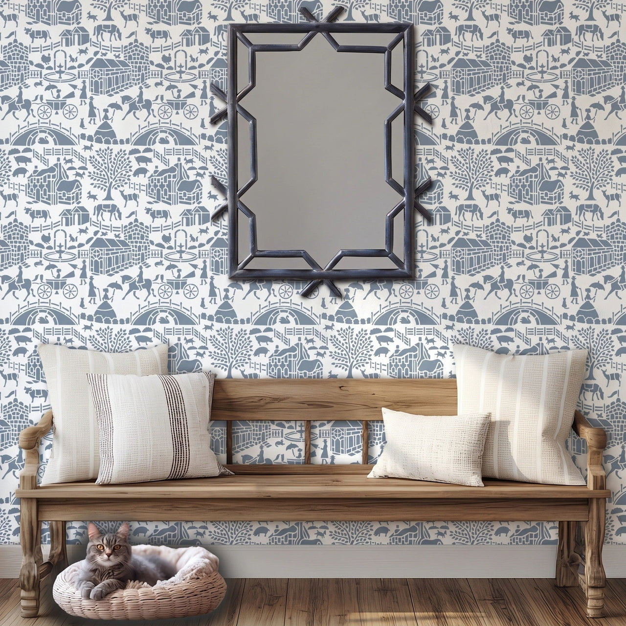 English storybook wall stencil applied in a hallway with a bench, pillows and a mirror, a cat lying in it's bed and natural light highlighting the blue and white painted stencil on the wall.