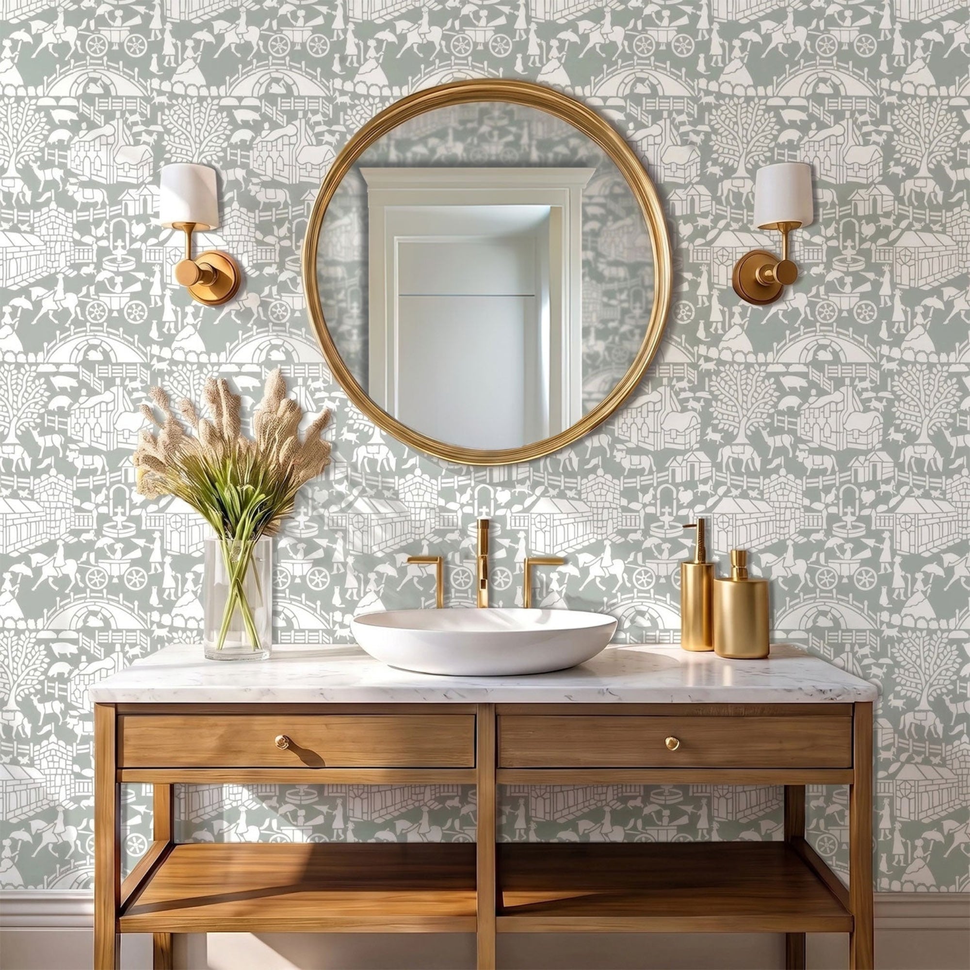 English storybook wall stencil in a bathroom room with a round brass framed mirror, a vanity, a sink, wall sconces, a vase with flowers, and natural light highlighting the green and white painted stencil on the wall.