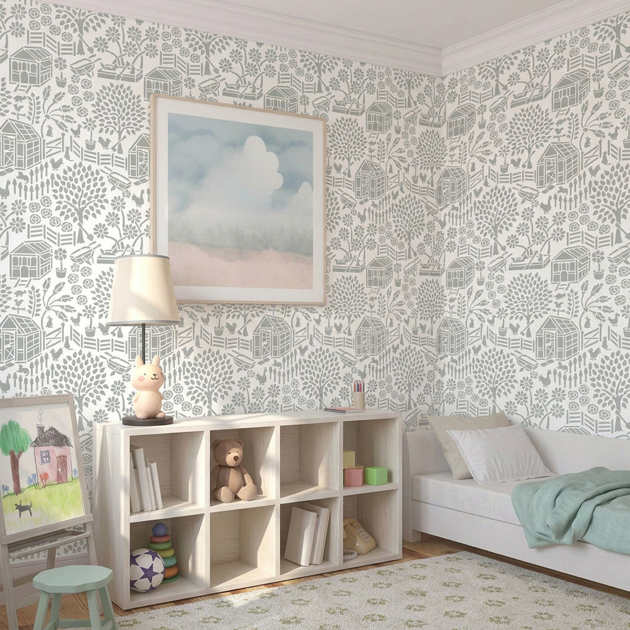 Floral garden stencil applied on the wall with a framed landscape print, a lit table lamp shaped like a rabbit, and a shelf with books and a teddy bear, and soft natural light highlighting the soft green and white painted stencil on the wall.