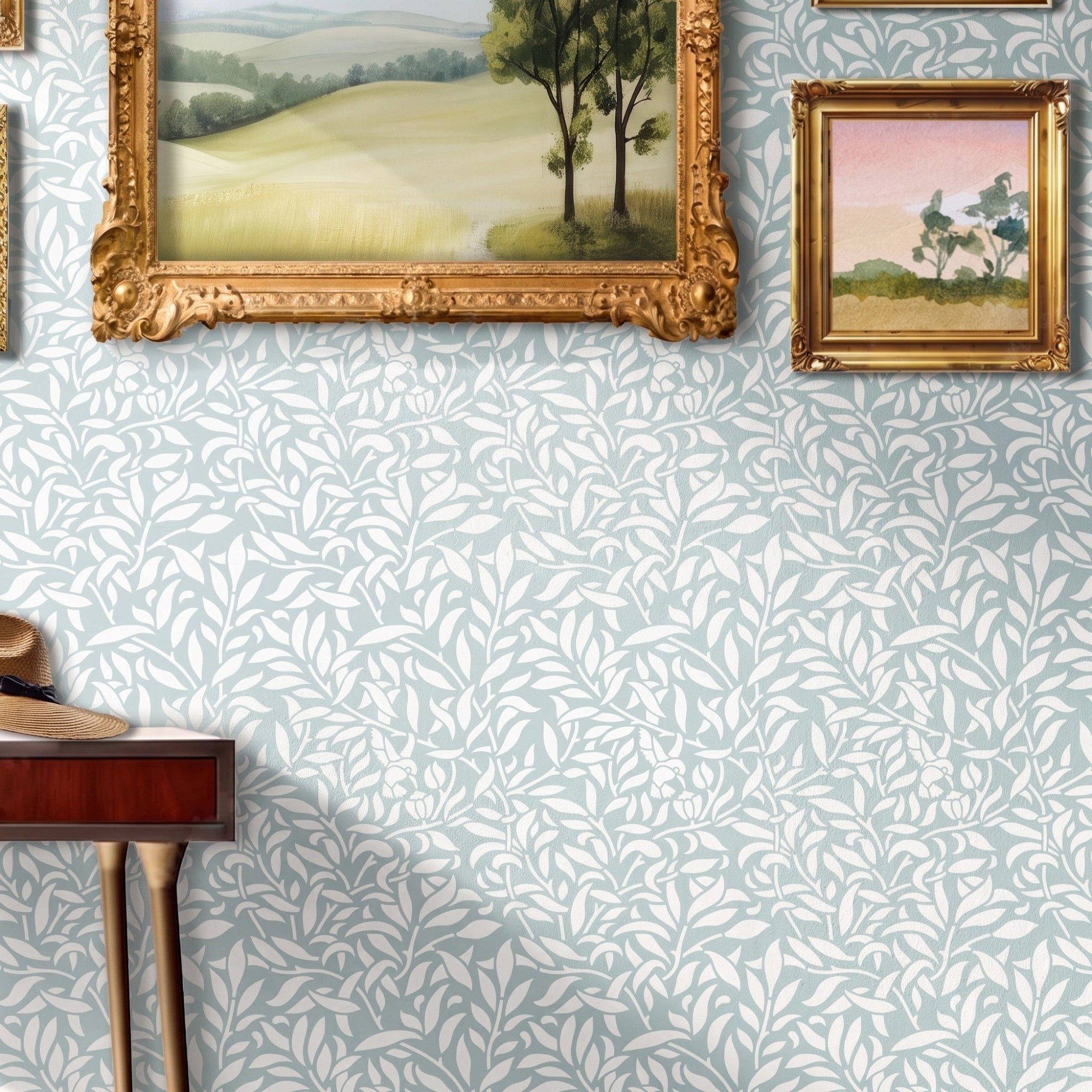 Hummingbird stencil in hallway with table, framed painting, and natural light highlighting the soft green and white painted stencil on the wall.
