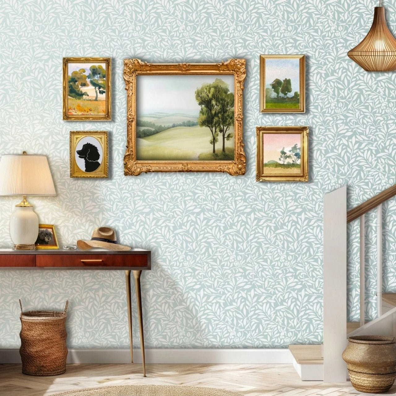 Hummingbird stencil in hallway with staircase, table, framed painting, a lamp, and natural light highlighting the soft green and white painted stencil on the wall.