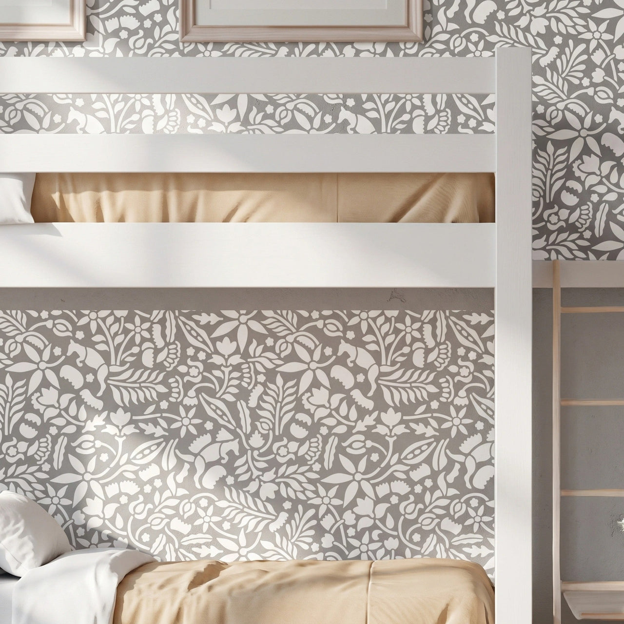 Woodland Foxes wall stencil applied behind a white bunk bed, featuring an all-over woodland pattern with foxes, flowers, leaves, and branches, and natural highlight the dark green and light green painted stencil on the wall.
