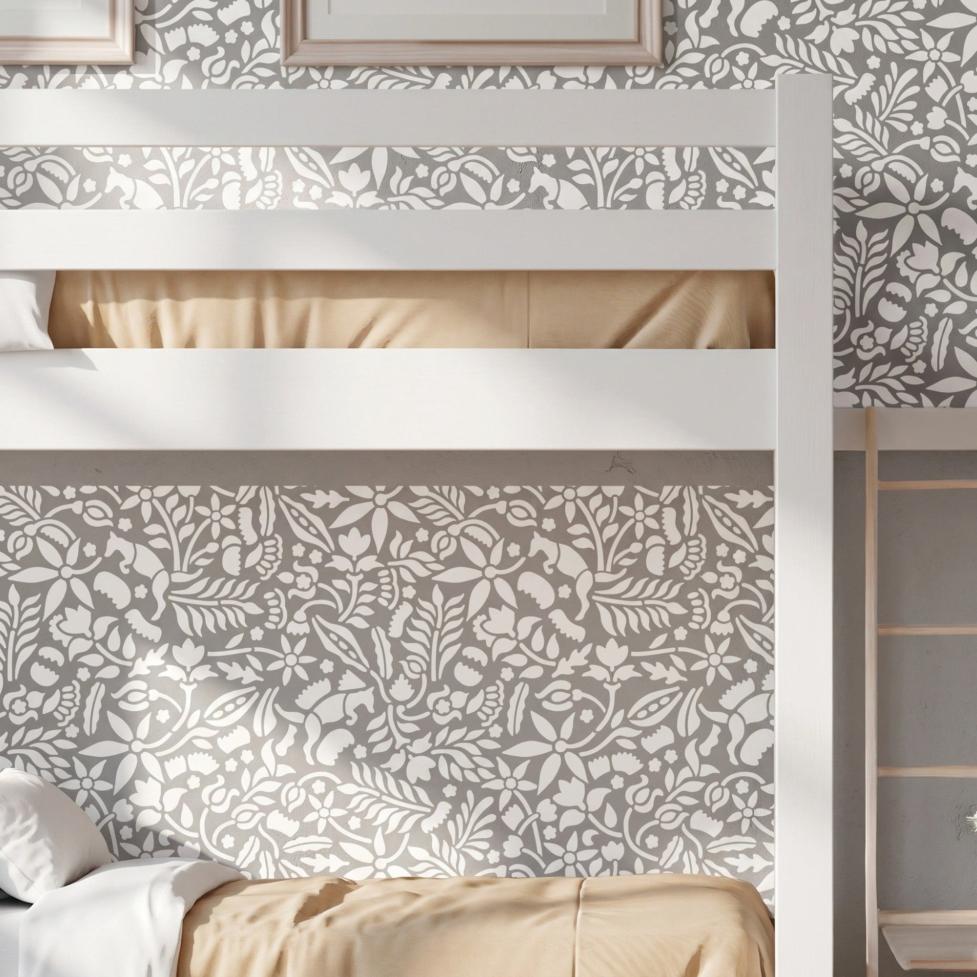 Woodland Foxes wall stencil applied behind a white bunk bed, featuring an all-over woodland pattern with foxes, flowers, leaves, and branches, and natural highlight the dark green and light green painted stencil on the wall.