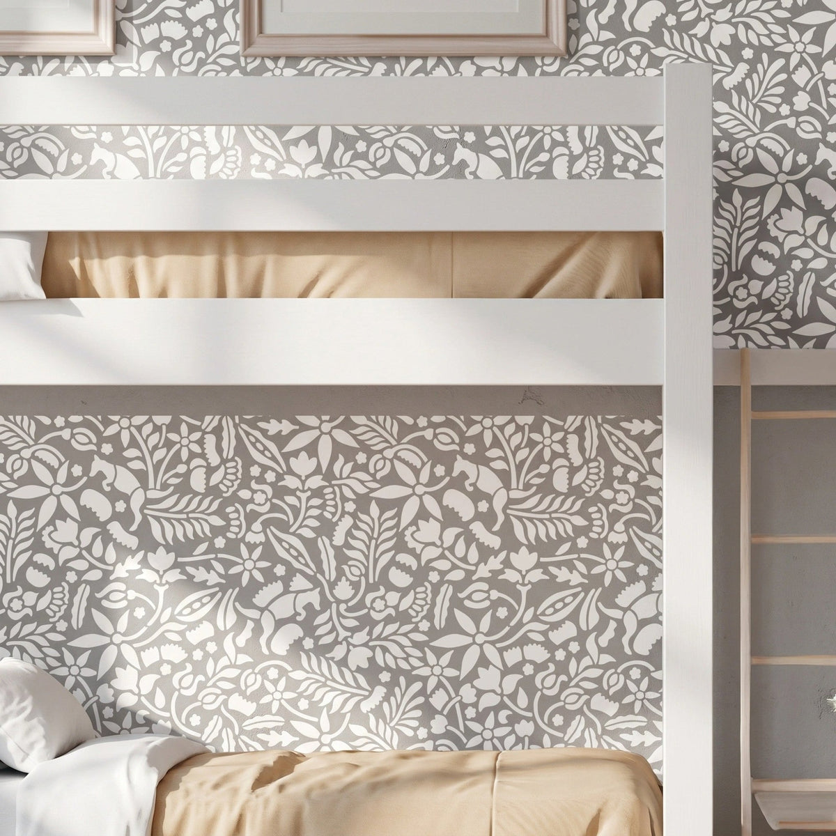 Woodland Foxes wall stencil applied behind a white bunk bed, featuring an all-over woodland pattern with foxes, flowers, leaves, and branches, and natural highlight the dark green and light green painted stencil on the wall.