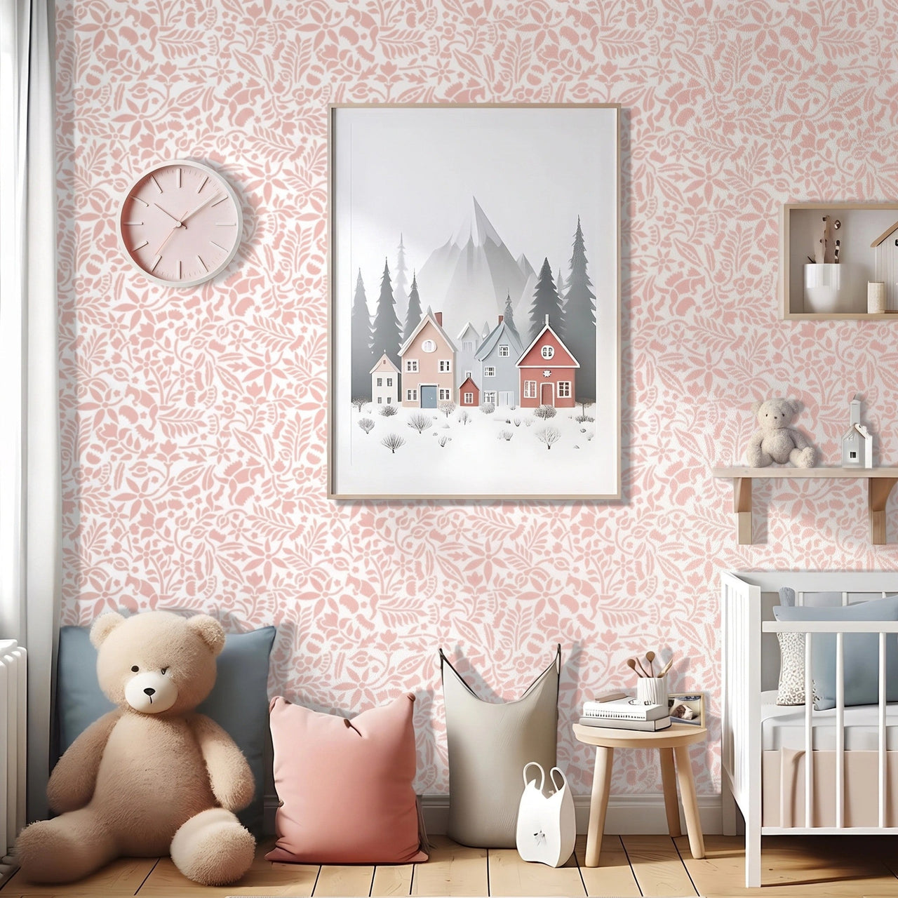 Woodland Foxes wall stencil applied in a soft pink and white nursery, shown behind a framed woodland village print with a teddy bear and pillows below, and the soft pink and white stencil on the wall.