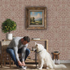 Topiary garden wall stencil. Man ties his shoe, retrieves the leash from the dogs mouth and leaves the room video.