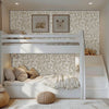 Enchanted forest wall stencil in bunkbed room. Two boys enter the room, followed by a dog. Both boys go to their beds