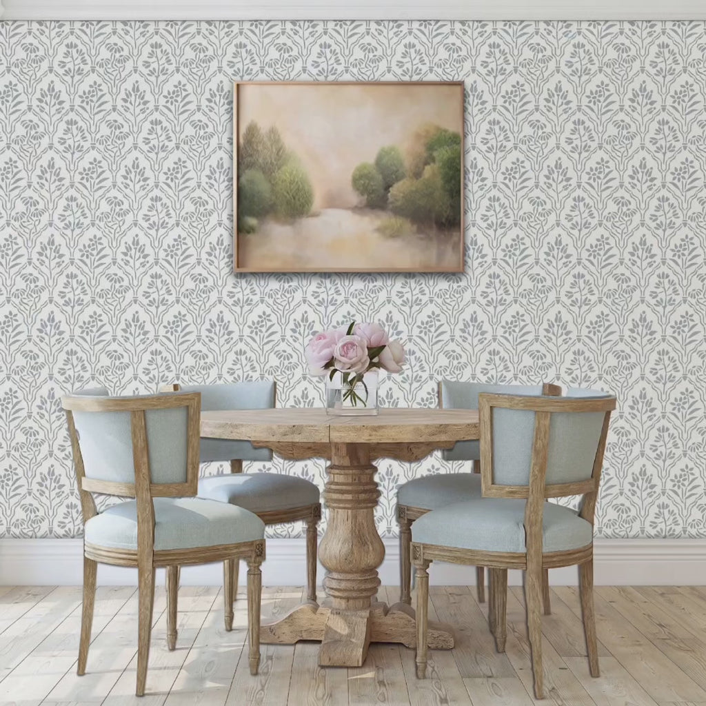 A couple enter their dining room with their son and daughter and their dog. The mother is carrying a birthday cake. They all sit down at the dining room table.