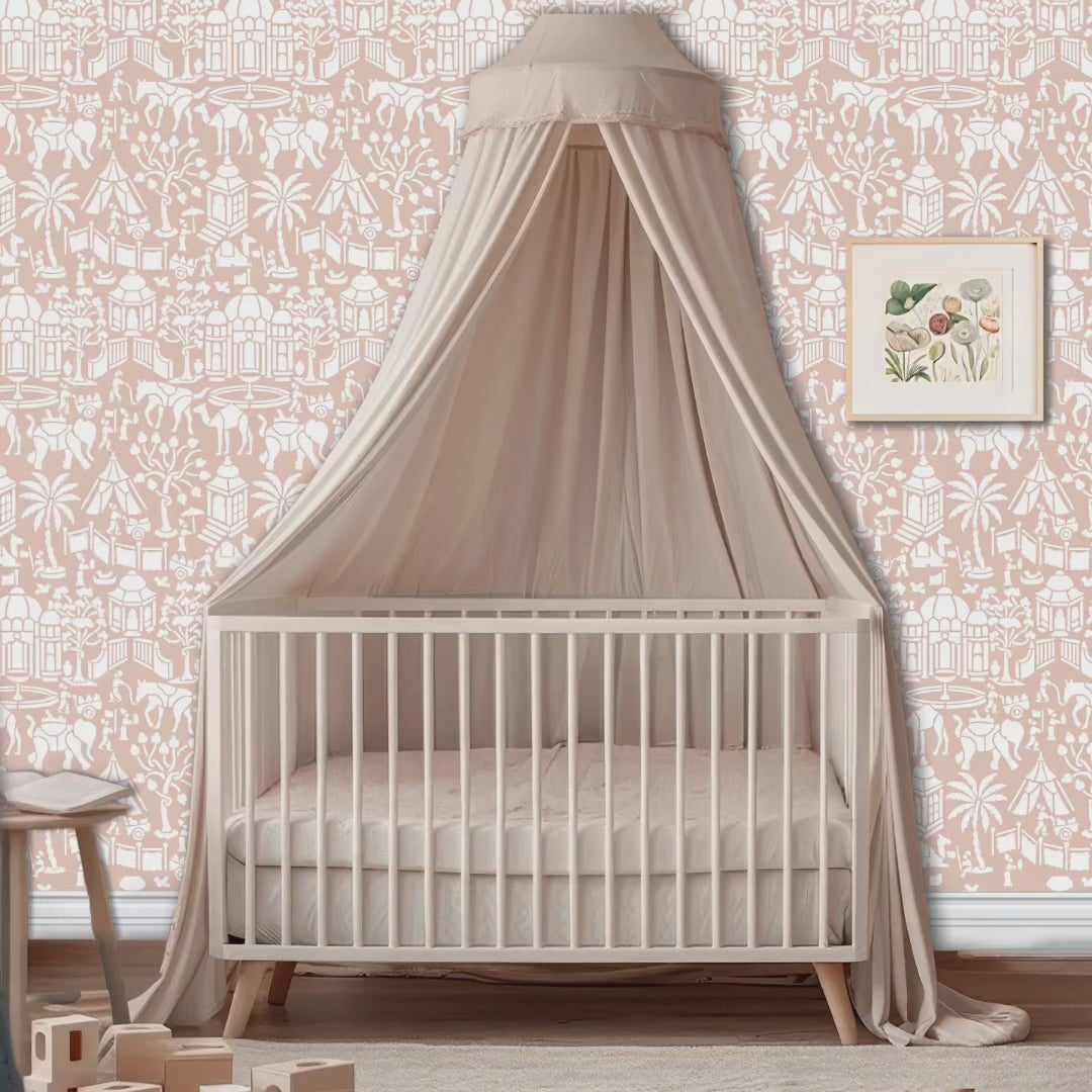 Indian village wall stencil in nursery. Woman enters room followed by a dog. She puts the baby in the crib, pets the dog and they leave the room video.