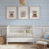 Spear thistle wall stencil in nursery. Man walks in with a dog in holding baby, puts baby in the crib and exits the room video.