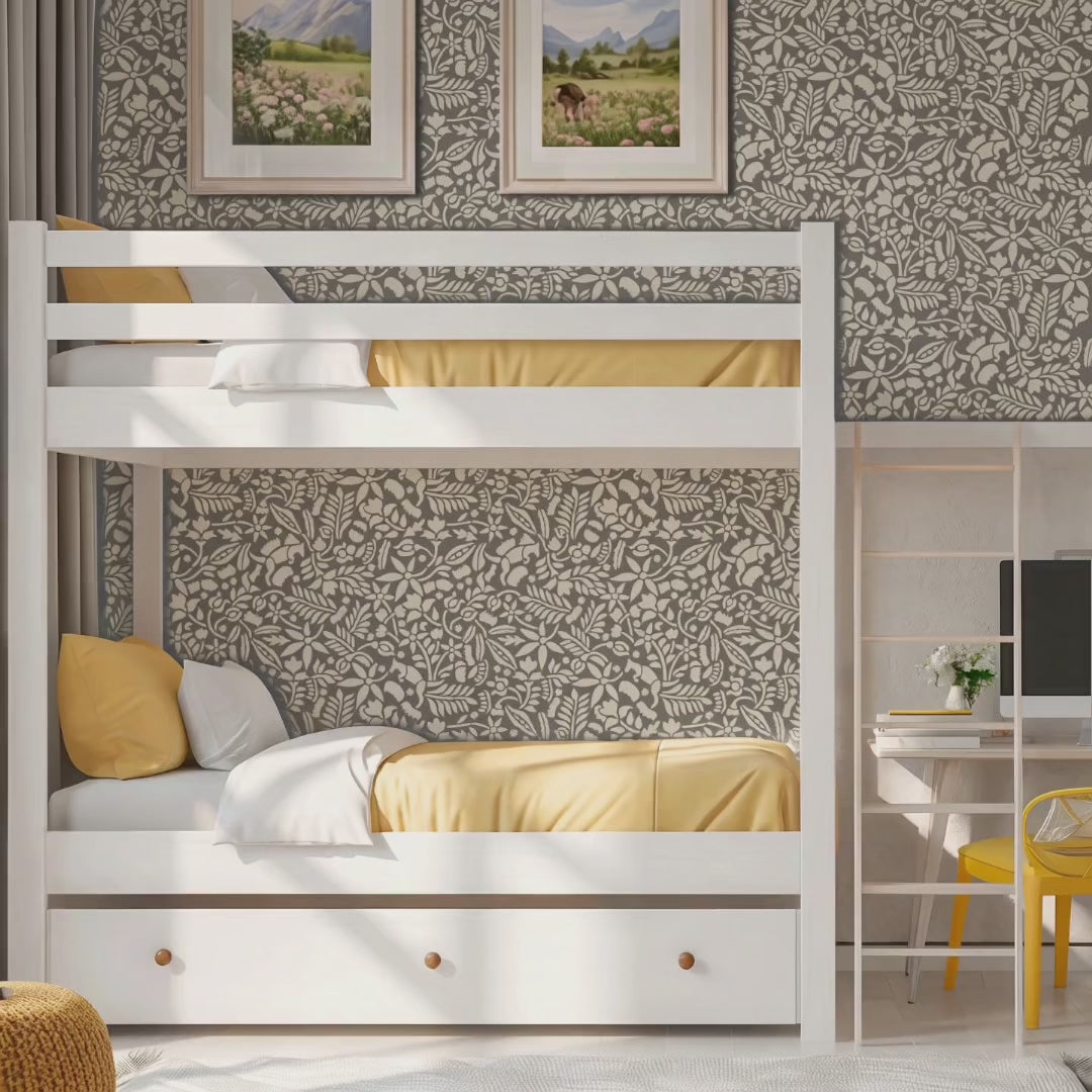 Video of woodland foxes wall stencil applied behind a white bunk bed, featuring an all-over woodland pattern with foxes, flowers, leaves, and branches, and natural highlight the greenish gray and white painted stencil on the wall. Mother and boy enter the bedroom, followed by a dog. Boy gets into lower bunk bed and the mother tucks him into bed.