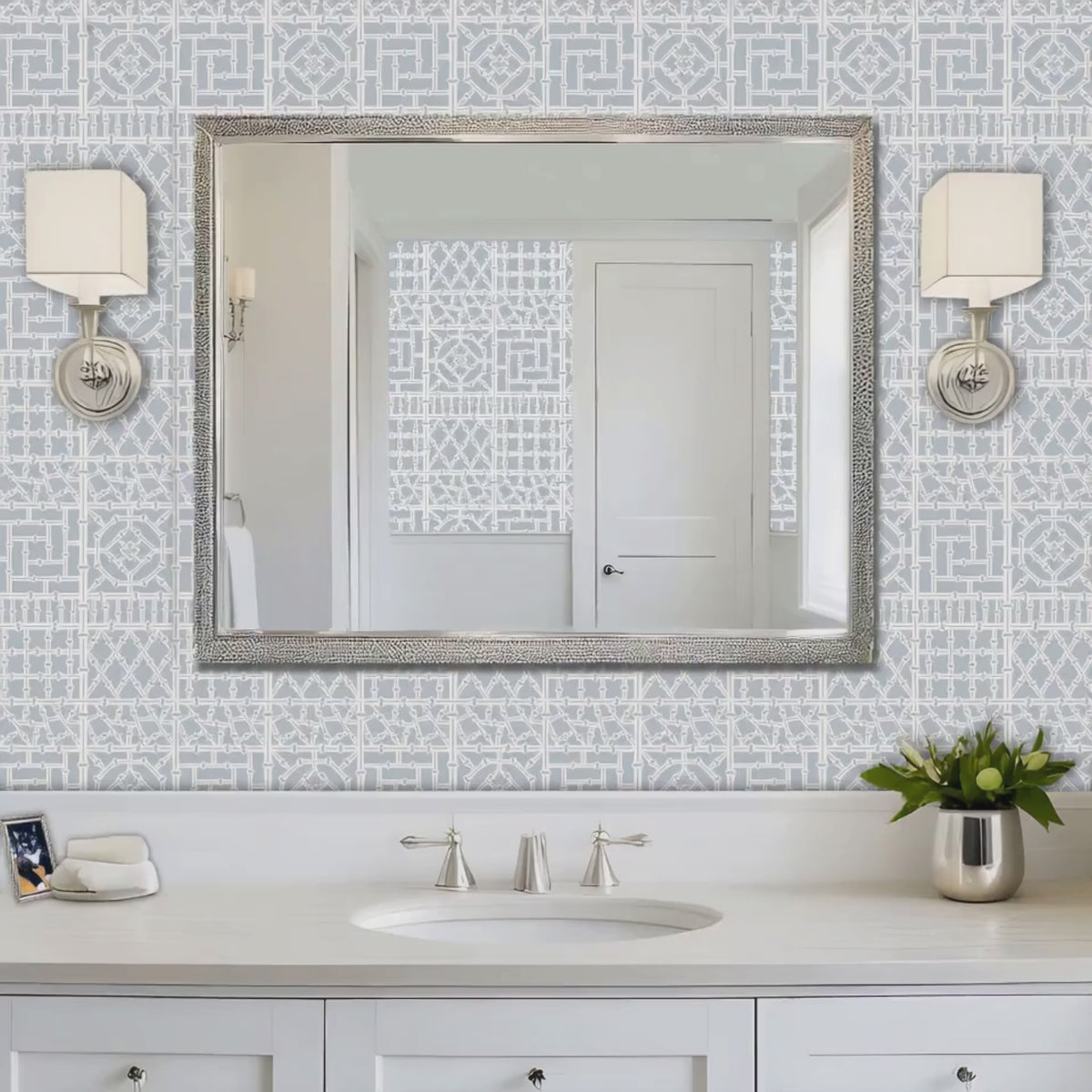 Bamboo wall stencil in powder room and woman walks in carrying towels video.