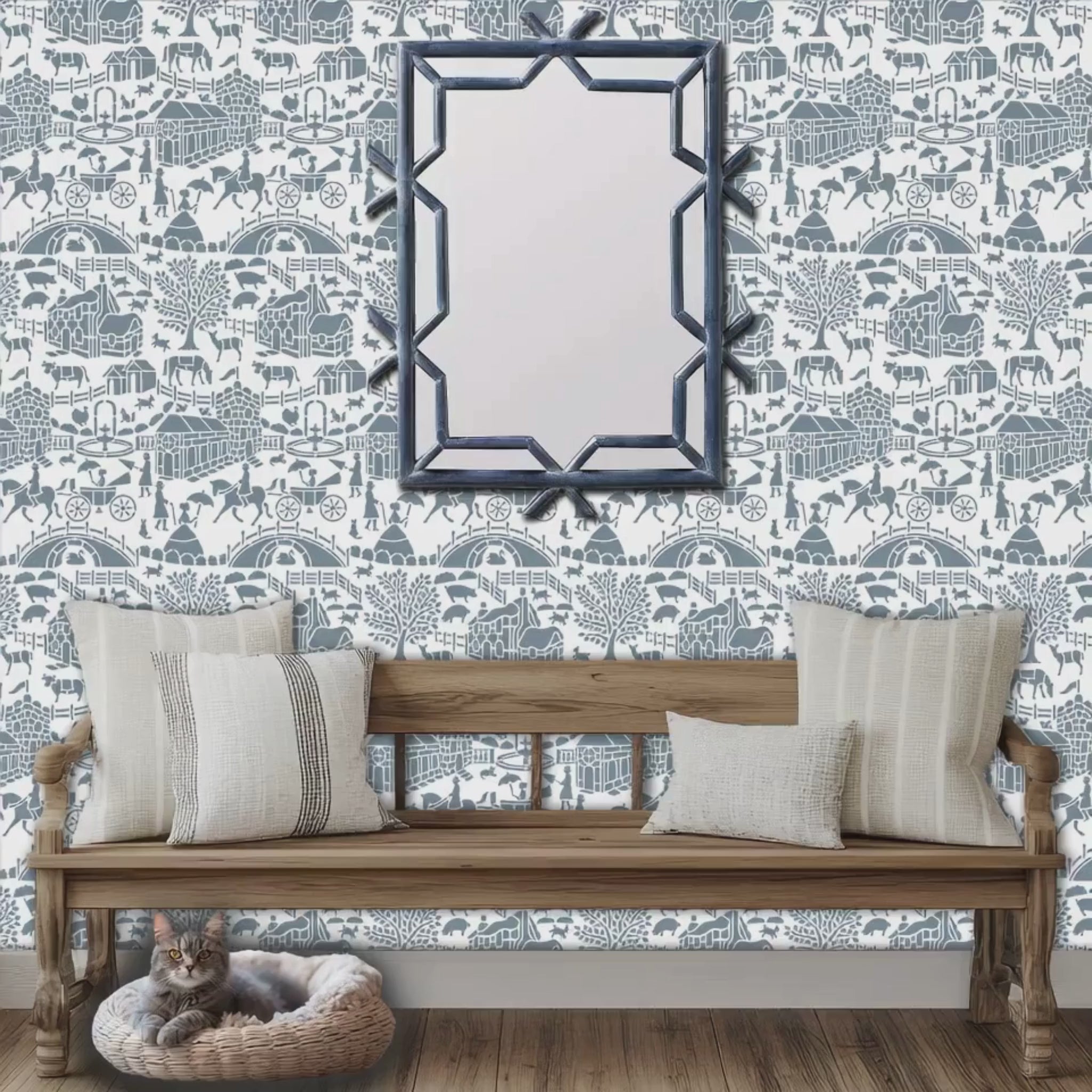 Video zooming in on, English storybook wall stencil applied in a hallway with a bench, pillows and a mirror, a cat lying in it's bed and natural light highlighting the blue and white painted stencil on the wall.