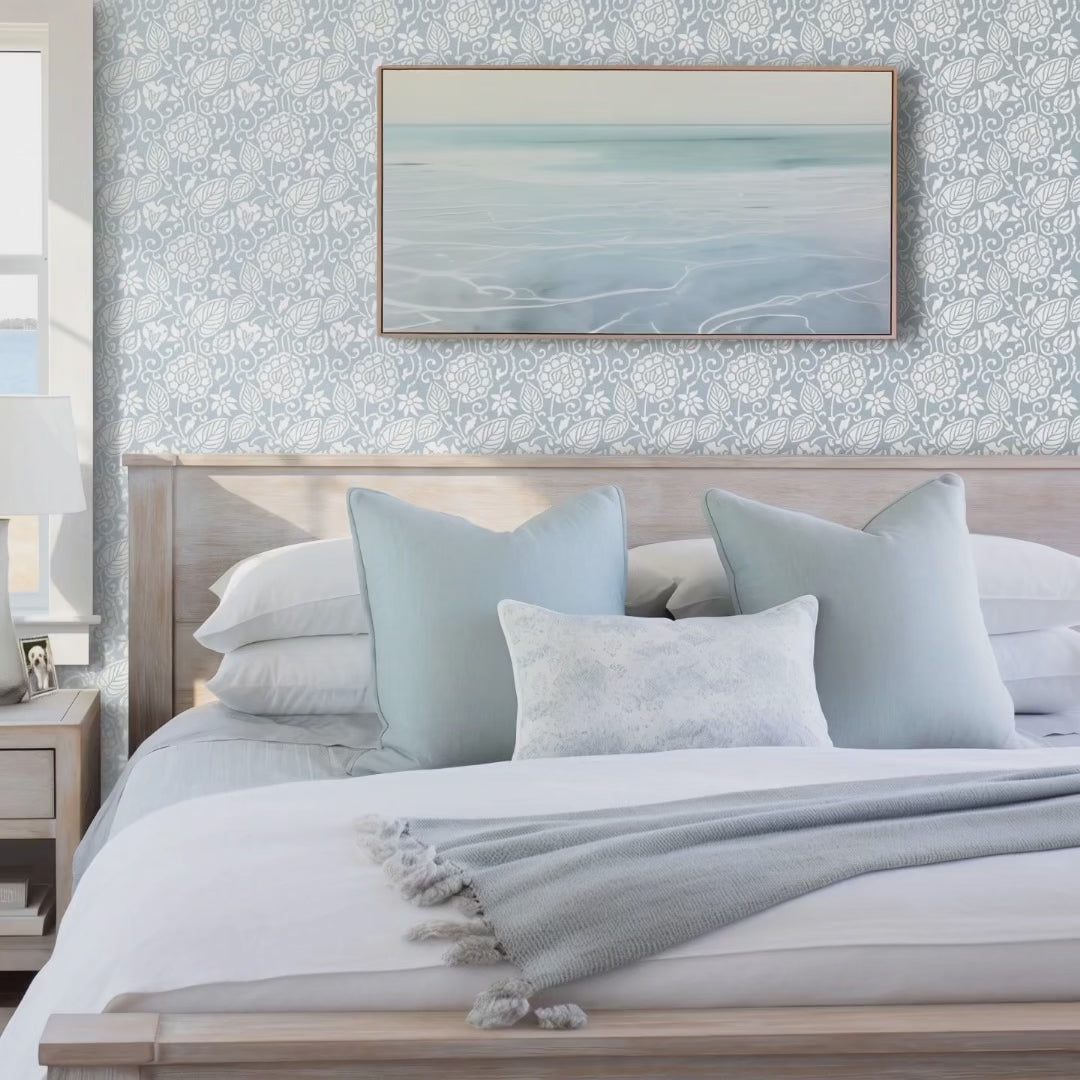 Dandelion wall stencil video. Woman enters bedroom, gets into bed and a small white dog jumps on the bed.