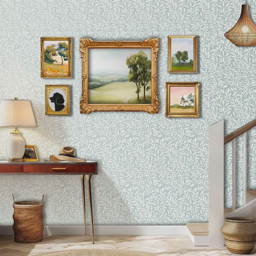 Hummingbirds wall stencil in hallway. Woman walks down the stairs, picks up a hat on the table and exits the room video.