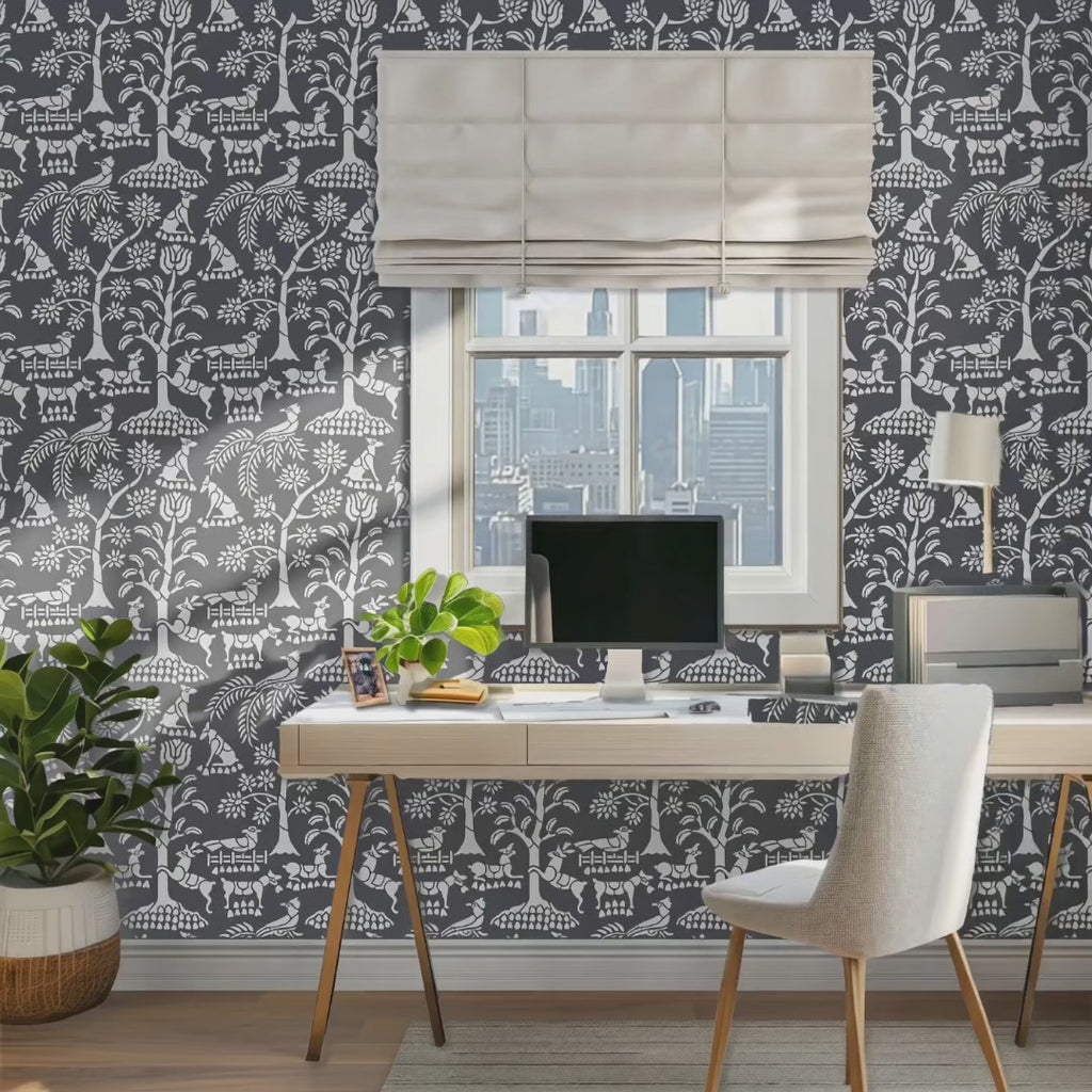 Enchanted forest wall stencil in office. Woman walks in and sits in the chair and pick up her cell phone