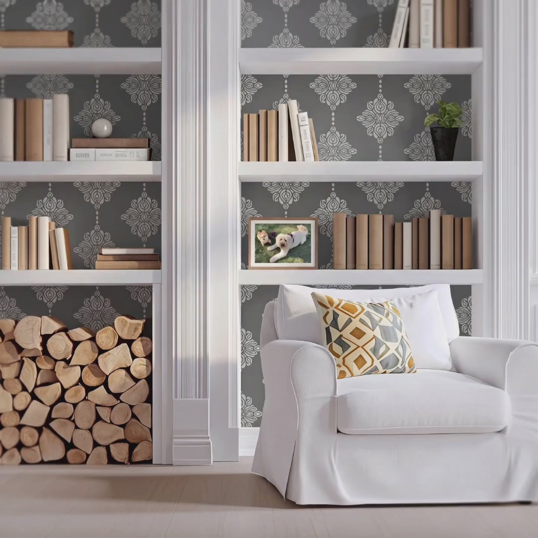 Damask Block Print wall stencil in library.Man enters carrying fireplace wood followed by a husky dog, then he sits in the chair and looks at his phone video.